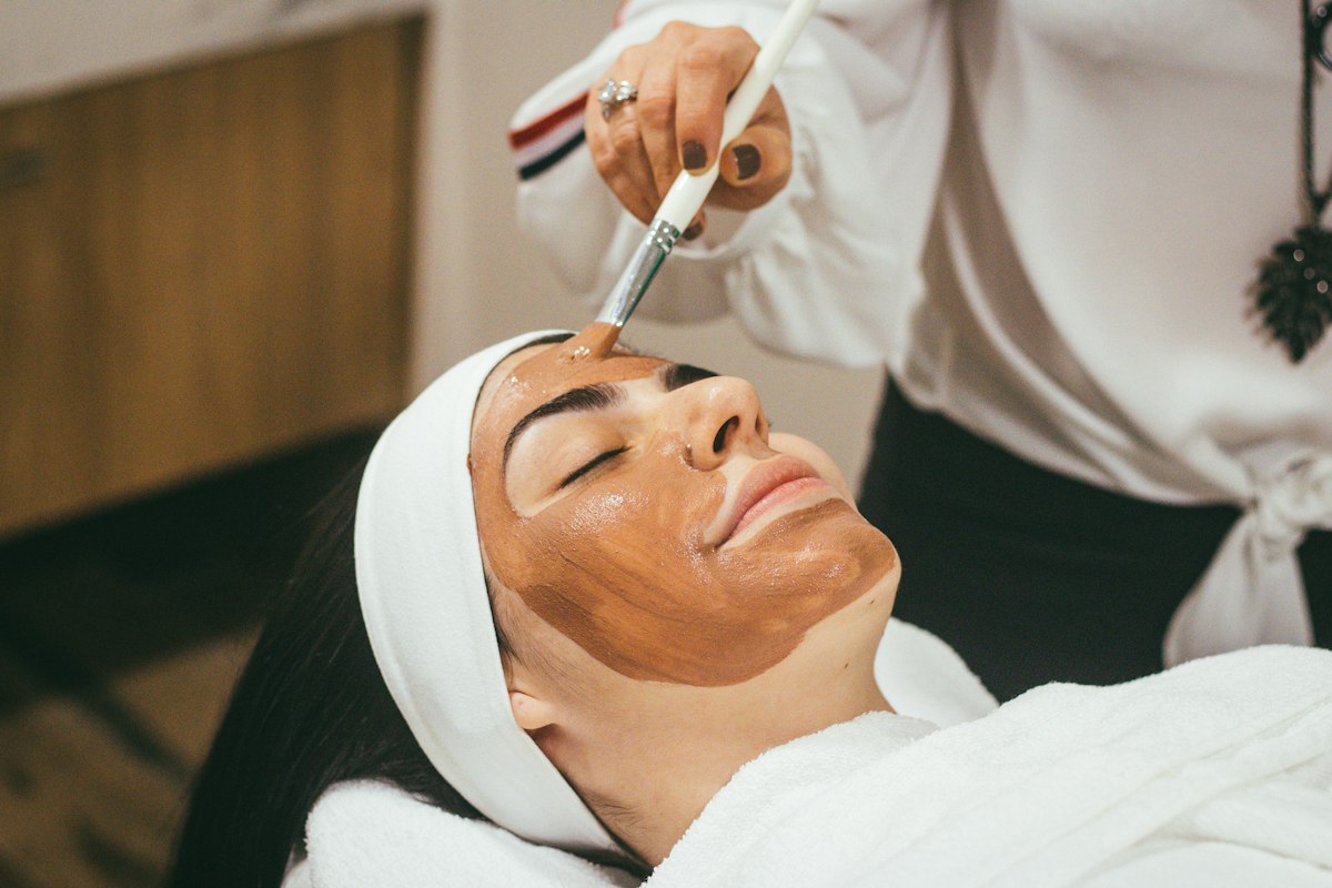 Illustrative photograph of a peel brushed onto the face.